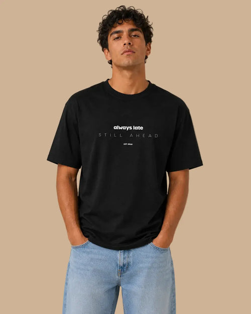 Front view of the Always Late Still Ahead black oversized Cabeça Dura T-shirt