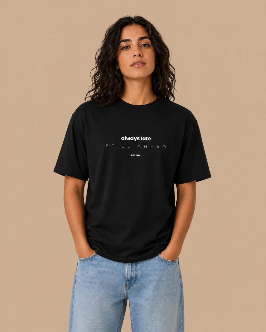 Female model wearing the Always Late Still Ahead black oversized T-shirt, front view