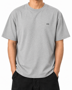Arguing With Me Builds Character — Heather Grey — Stella Embroidered Heather Grey worn front on white