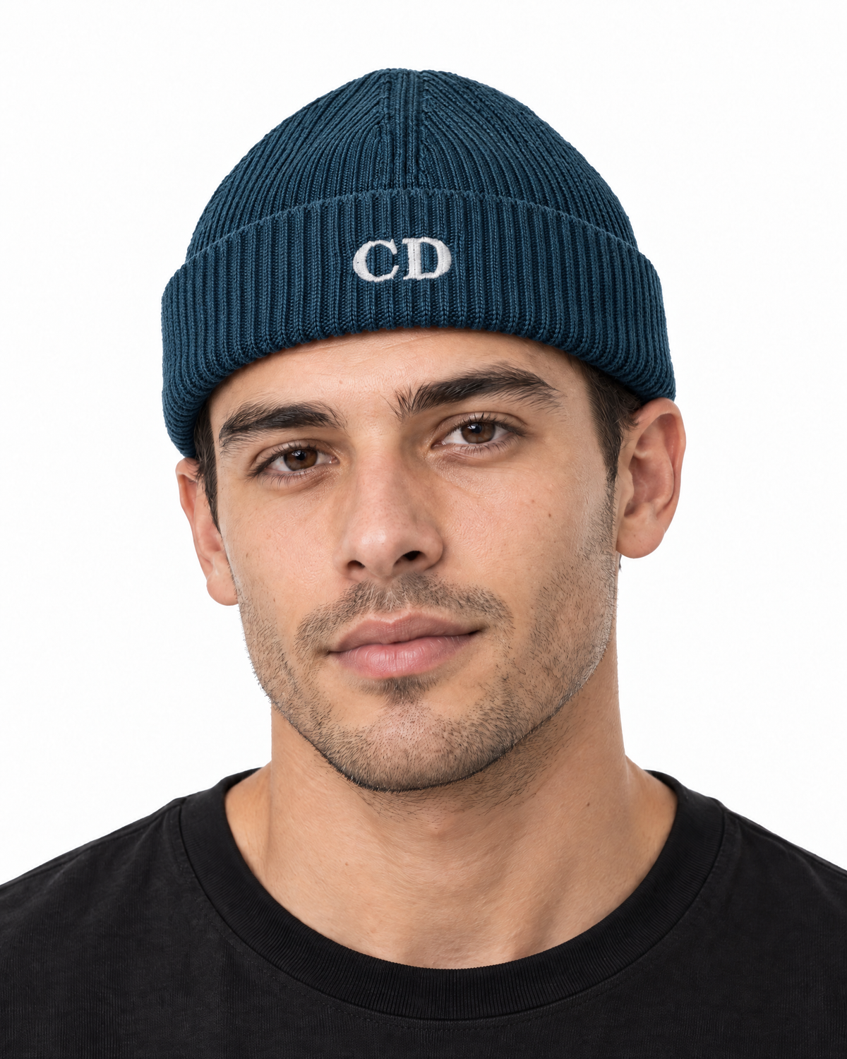 CD Fisherman Beanie — Deep Teal, worn front view on a white background with white CD embroidery.