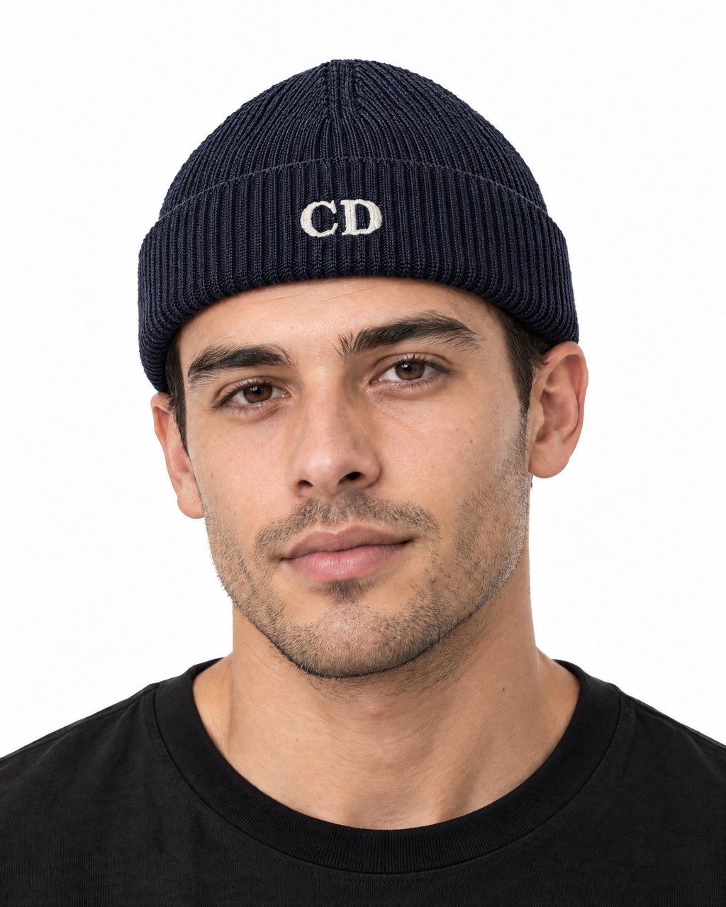 CD Fisherman Beanie — Navy, worn front portrait on a white background with white CD embroidery.