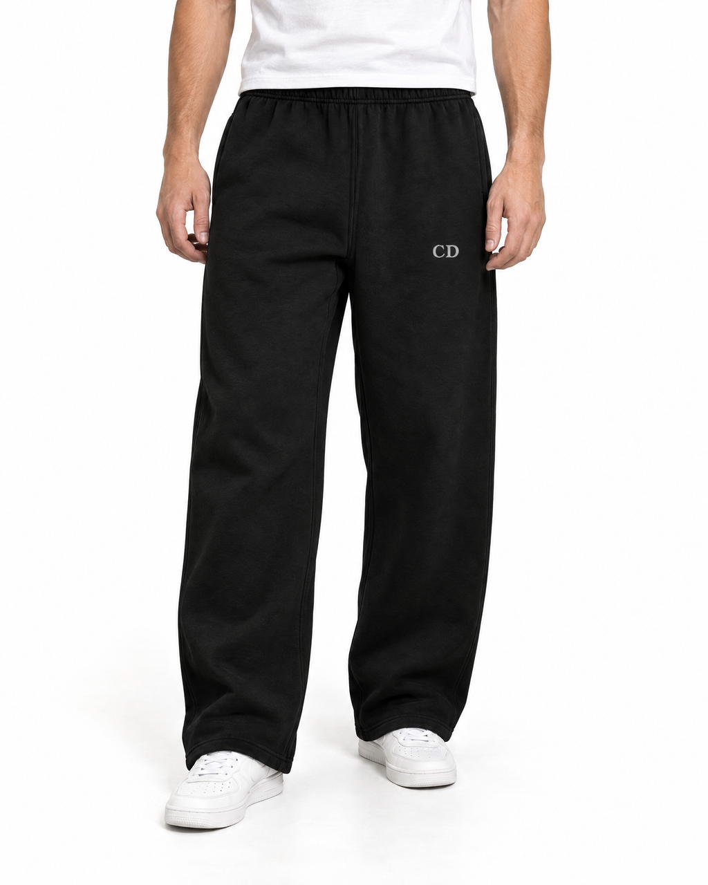 CD Heavyweight Joggers — Deep Black, worn front view on a white background with white CD embroidery.