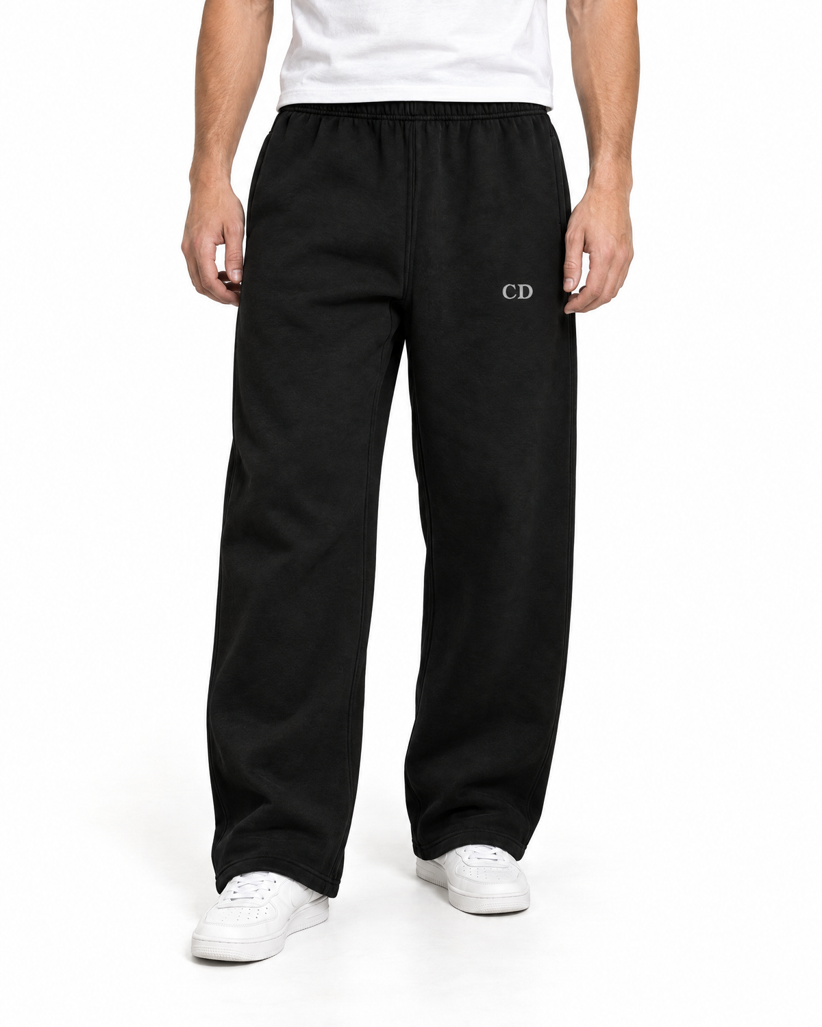 CD Heavyweight Joggers — Deep Black, worn front view on a white background with white CD embroidery.
