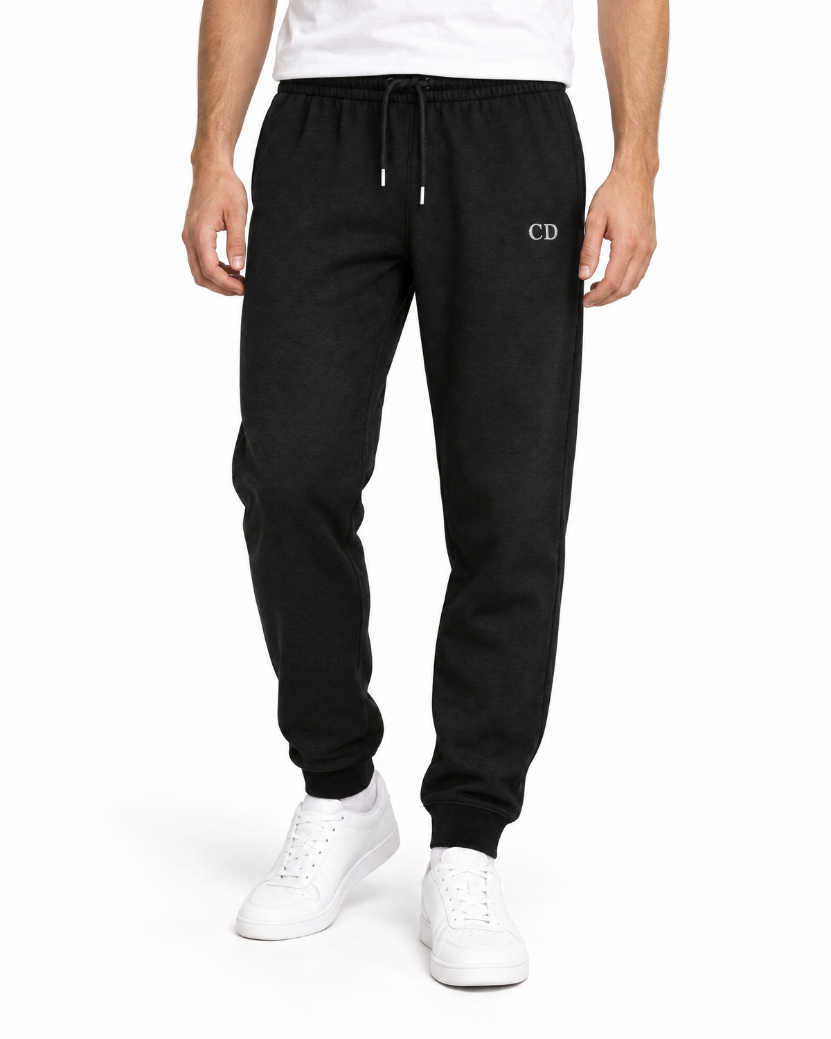 CD Mover Joggers — Black, worn front view on a white background with white CD embroidery.