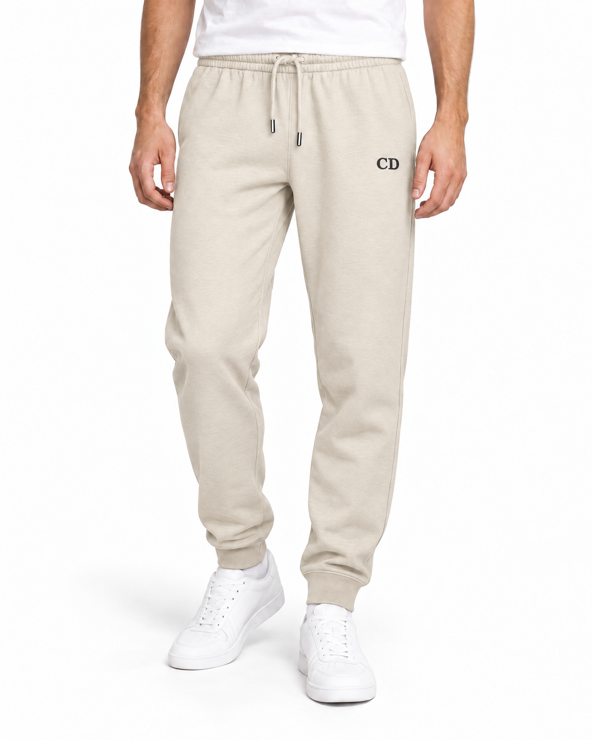 CD Mover Joggers — Natural Raw, worn front view on a white background with black CD embroidery.