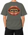 Gilded Vice T-Shirt — Khaki, model A wearing the T-shirt, back view on a white background.