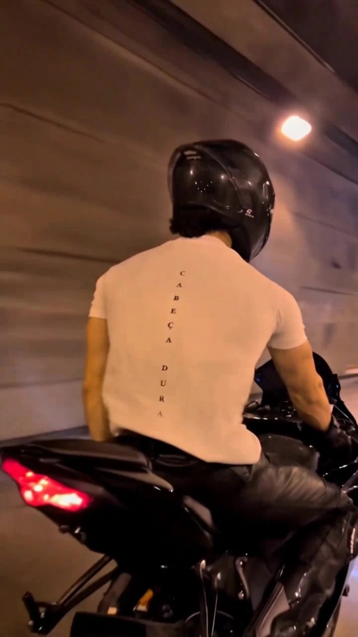 Augusta cream T-shirt seen from behind on a motorcycle in a tunnel