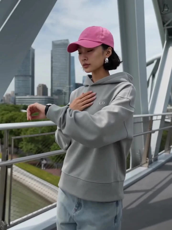 Front of the Augusta Silver Profile Misty Grey hoodie on a bridge