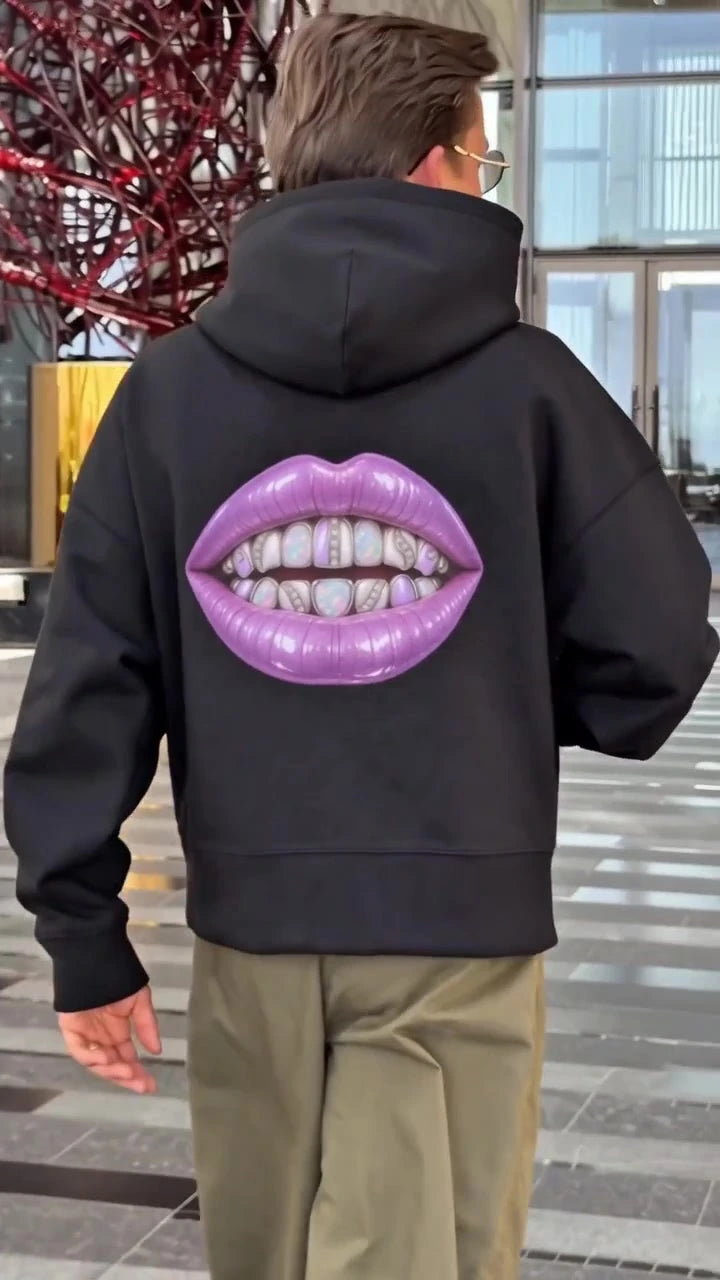 Back view of a black Augusta Soft Power hoodie with the purple mouth graphic