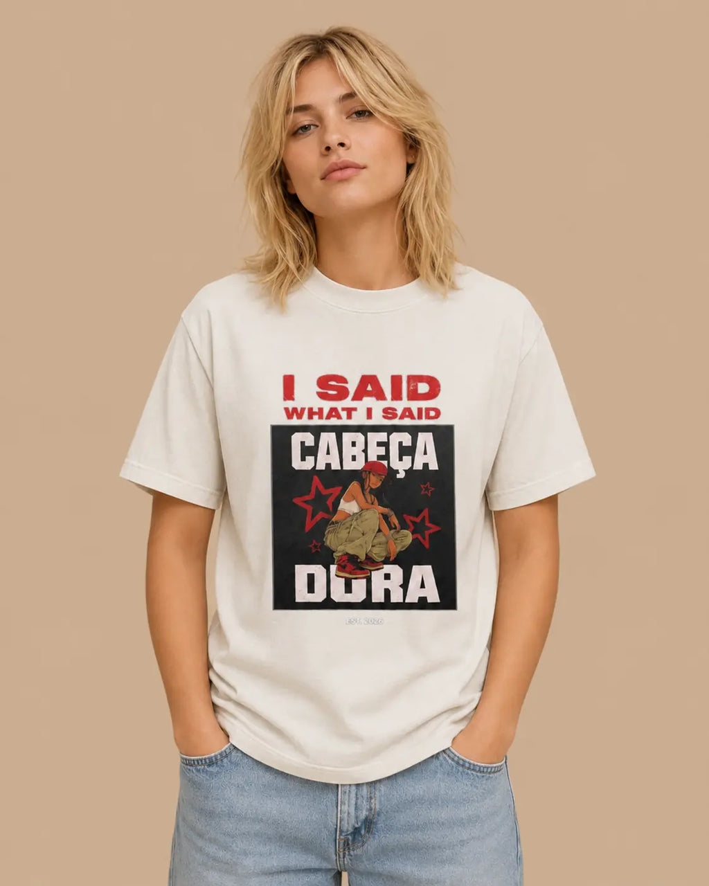Female model wearing the I Said What I Said faded bone oversized T-shirt, front view