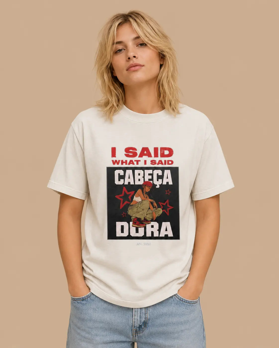 Female model wearing the I Said What I Said faded bone oversized T-shirt, front view