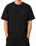 Unmoved — Black — Stella Embroidered Black worn front on white